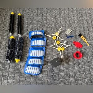 New Roomba replacement parts. Brush heads, filters, and beam stopper piece.